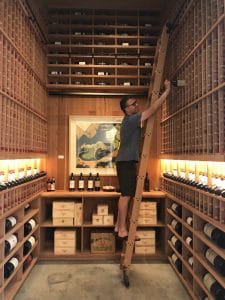 Michael checking the wooden wine racking
