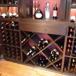 Since our wine cellar door is made of glass and the room is visible from the outside, we made sure to make the rack design as interesting as possible by combining different storage styles.