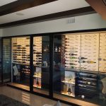 Aesthetics-wise, we made sure our modern wine room still matched with the rest of the living room, including the dark wooden beams on the ceiling.