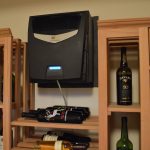 This wine cellar cooling unit is a through-the-wall type. This was installed first before we brought in the custom rustic wine cellar racks.