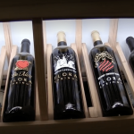 The team included one high reveal display row in their rustic wine cellar design. This row had a dedicated lighting system hidden behind a light valance.