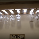 For every rustic wine cellar design we're asked to make, we always consider what the owner already has in his collection — including stemware and decanting tools!