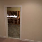 From the outside, you can already see the wooden wine racks.