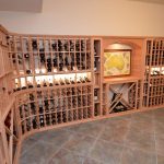 The map you see on the arched table top is a personal collection of the owner. He wanted to display this special memorabilia so the team thought it would make a great centerpiece in the rustic wine cellar design.