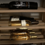 Here is a close-up of the triple deep horizontal wine racks. One row can accommodate 3 bottles, whether it's standard-sized or magnum-sized.