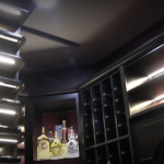 The narrow slit you see on the ceiling is one of two airflow registers for the wine cooling unit. The split-type system we used was so quiet, that when you open the wine cellar door and go in, you won't feel that noisy, buzzing noise from a machine.