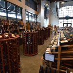 Free standing wooden wine racks and wall-set racks dominated this commercial custom wine cellar.