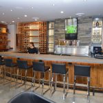 This massive commercial custom wine cellar features a wine bar and lounge where customers could come in and have a lovely brunch.