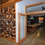 Commercial custom wine cellars can be upgraded with a unique design and special designated spaces like this in-house wine lounge.