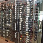 The frameless wine wall glass doors come with brushed aluminum door handles, U-channels, and pivot hinges.