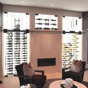 22 - This modern home wine cellar features cable wine racking, LED lighting, and frameless glass doors.