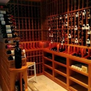 32 - This cascading wine rack gives a nice touch of flair and a visual centerpiece to this custom wine cellar.