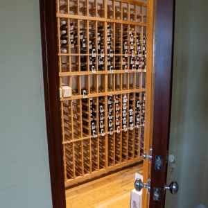 20 - This minimalist home wine room prioritizes bottle capacity and organization.
