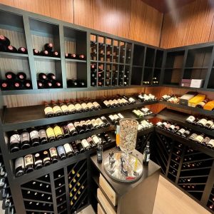 35 - A dark stain on this wooden wine racking gives a beautiful contrast to the wooden walls.