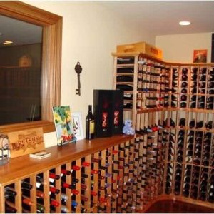 13 - A traditional home wine cellar with cork forward wooden racking. Traditional Wine Cellar in Basement