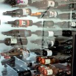 The display idea of this modern wine cellar was for the bottles to stay horizontal and label-forward.
