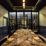 The door you see on the left of this modern wine display is the emergency exit. The main door from the kitchen is actually the wall you see on the right. It's that secret! Private Modern Wine Displays