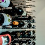 A pair of metal rods can hold three standard-sized wine bottles. Can you imagine how many bottles can fit in this wine closet?