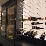 A custom wine cellar that serves two purposes: for wines and cigars.