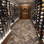 Because the theme of the room is contemporary, we combined metal and wood to make up our entire wine wall design.