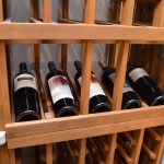 Reveal rows makes it easy for this client to recognize the bottles within the wooden wine rack.