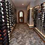 This wine wall design helped eliminate dead wall space inside this wine room.