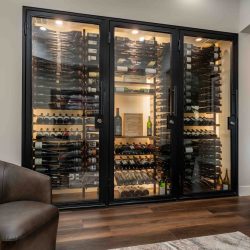 The space above this modern wine closet design was allocated for the cooling system.