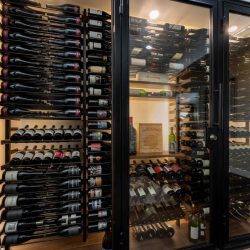 Displaying wine bottles in various orientations keeps the display looking interesting.