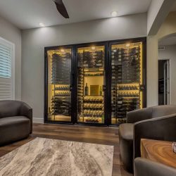 This modern wine closet design's warm yellow lights sets a more relaxed mood for when you want to take a peaceful sip after a hard day's work.